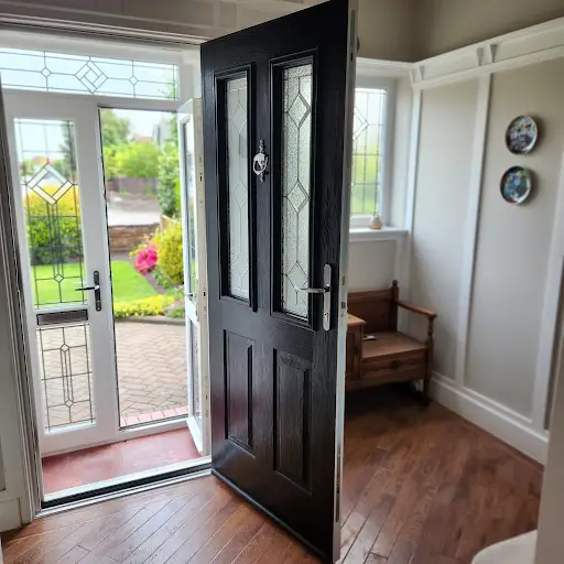 Black composite entrance door with decorative leaded glass